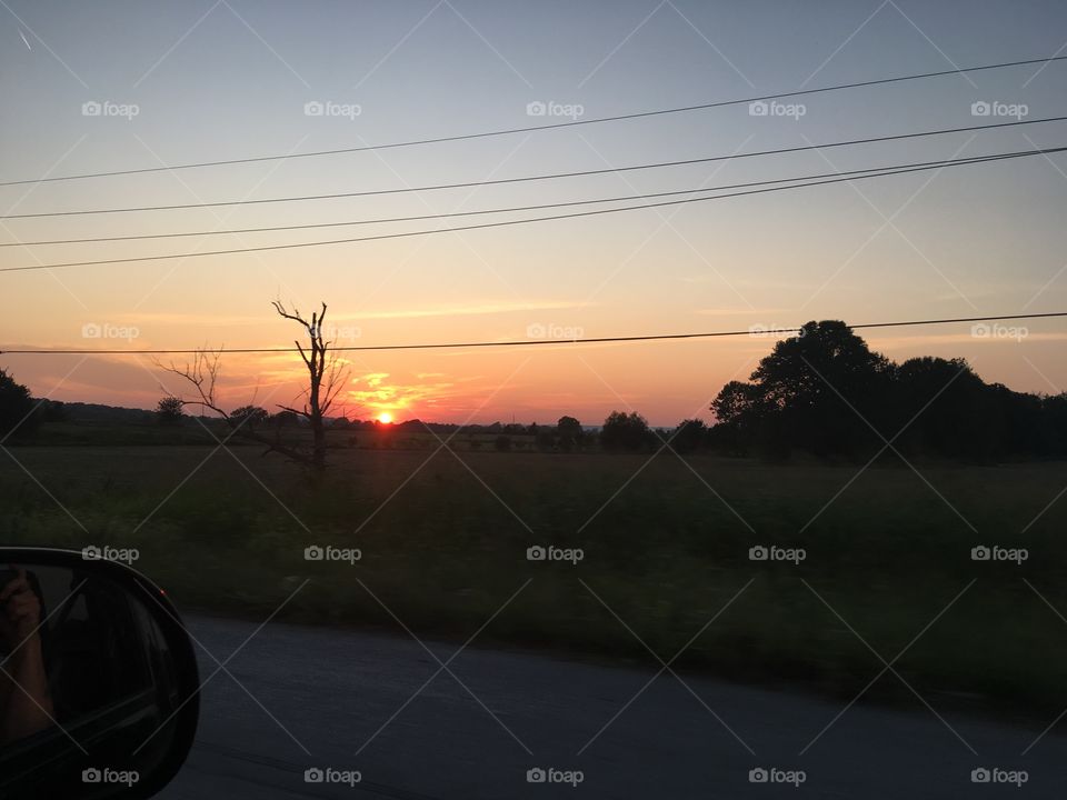 Colors of a sunset, bright orange with blue sky. God knows how to paint with such perfection.