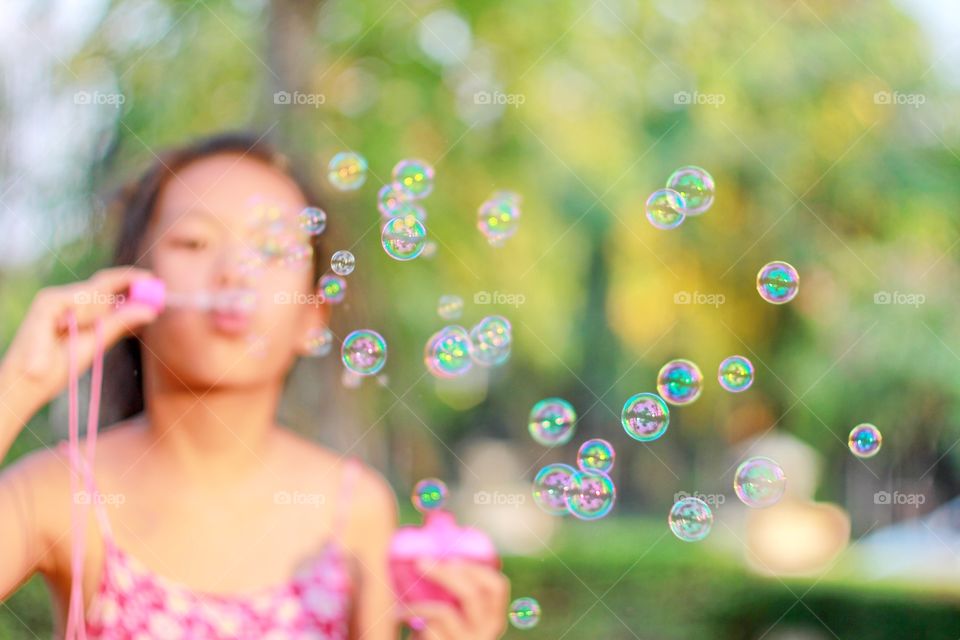 Girl playing bubble 