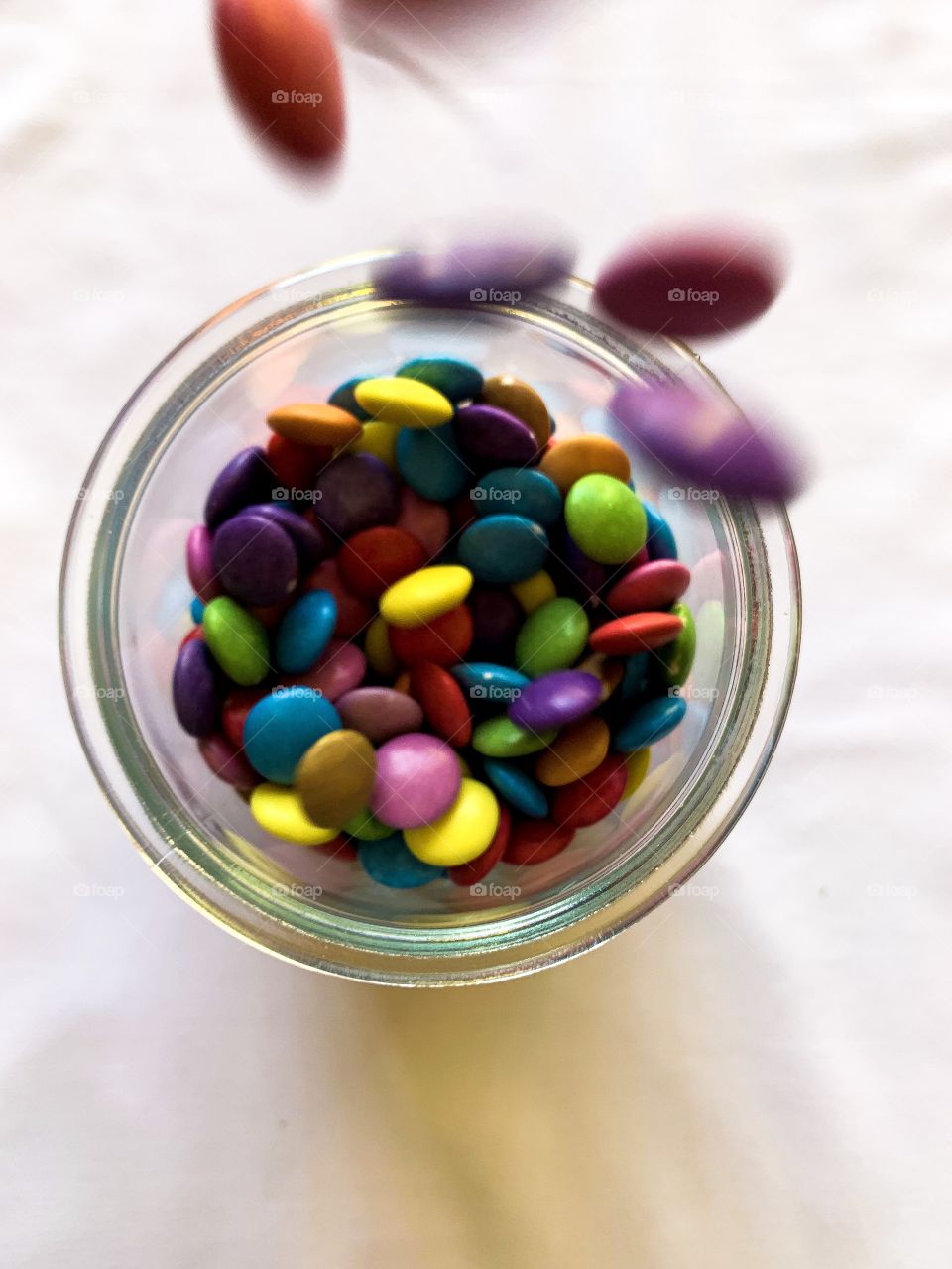 Clash of colours. Got to love the colourful smarties brighting up the container