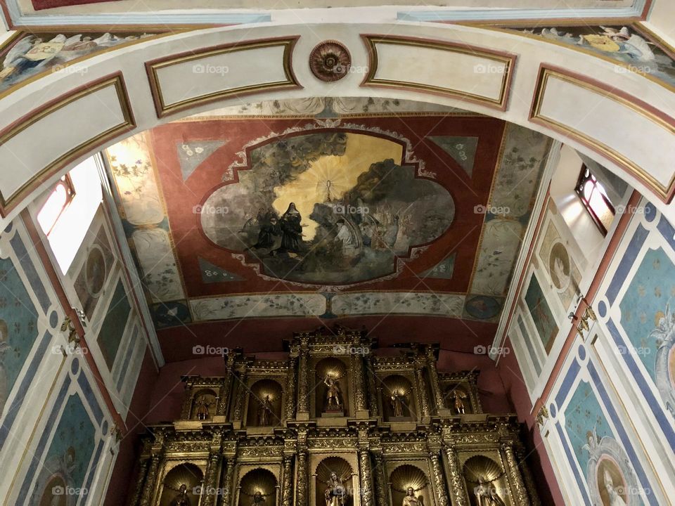 A beautifully ornate archway inside a church in Bogota, Colombia 