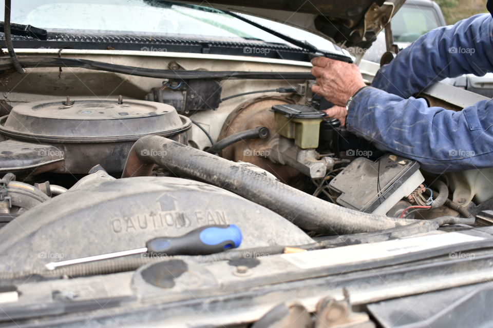 mechanic repairing a vehicle