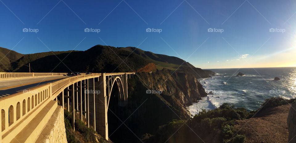 Driving the famous Pacific Coast Highway and crossing Bixby Bridge.