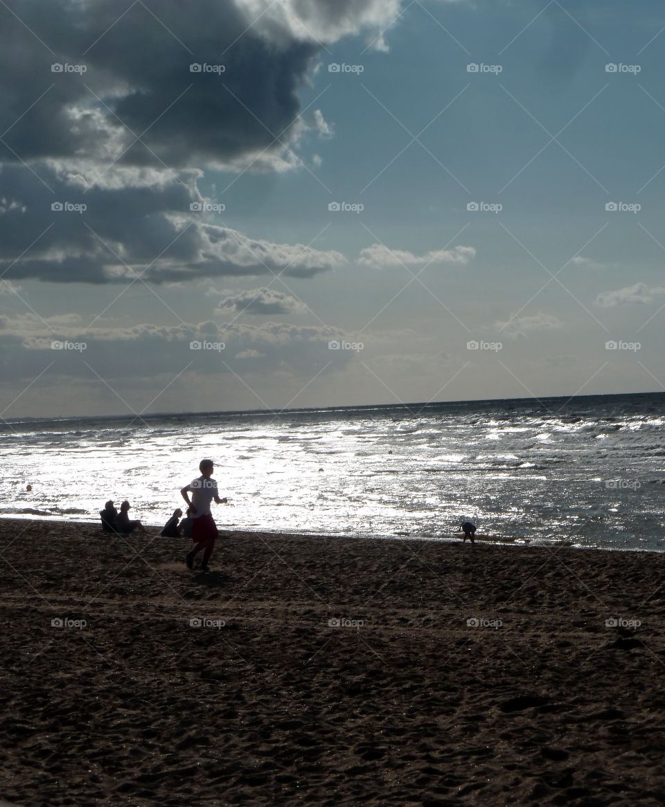 running at sunset on the beach of Deauville