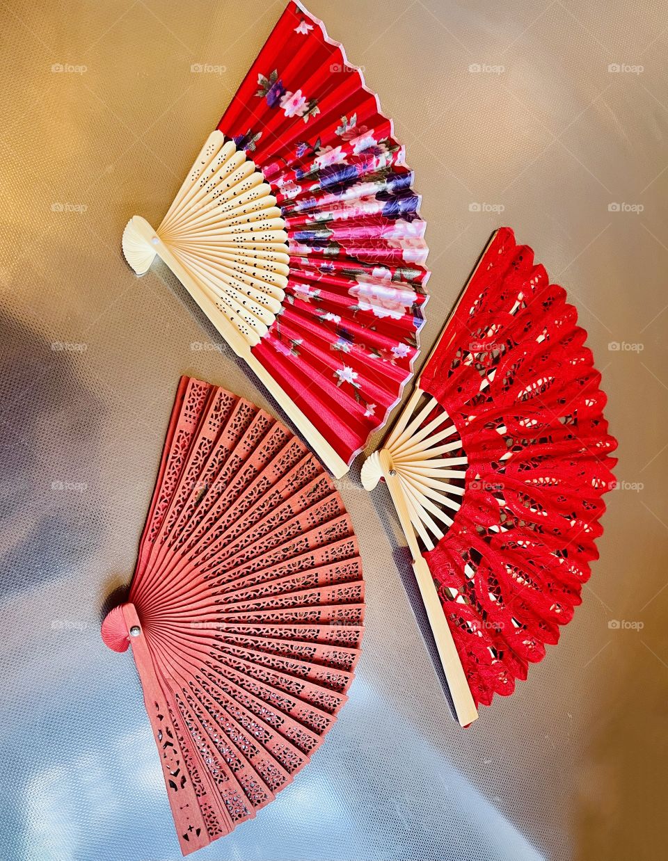 Hand fans, pretty little  objects to keep you cool. The fan originated about 400 years ago in Egypt. The fan became especially popular in Spain, where flamenco dancers used the fan and extended its use to the nobility.