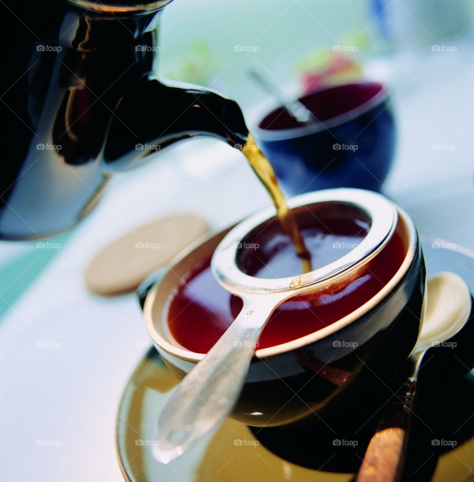 Tea pouring in the cup