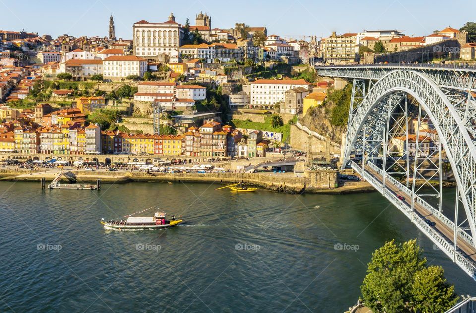 The hustle and bustle of Porto on the Douro river, in the afternoon sun