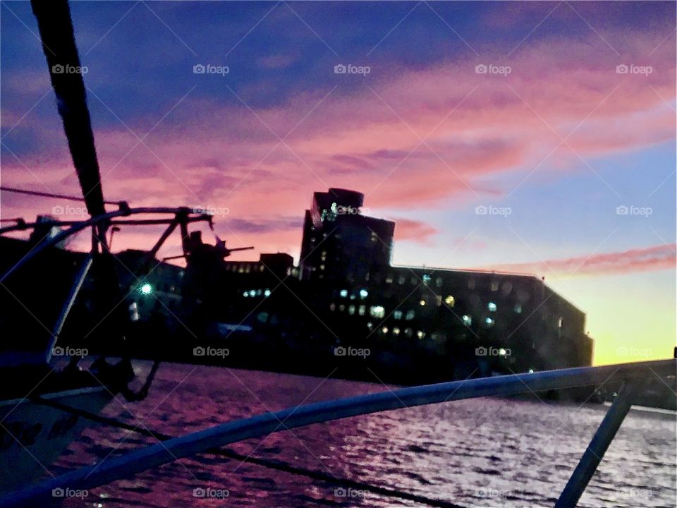 A spectacular sunset leading into twilight and nightfall at Newtown Creek in LIC, Queens, NY in late 2021. The waters of the East River reflect the setting sun’s last rays. Hypnotic Productions