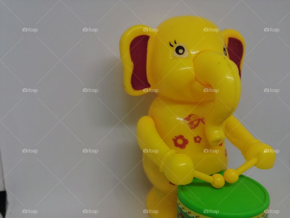 Toy Elephant beat drum with white background