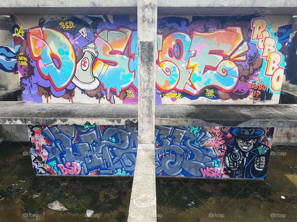 urban playground, colorful vivid street art graffiti at an empty deserted building