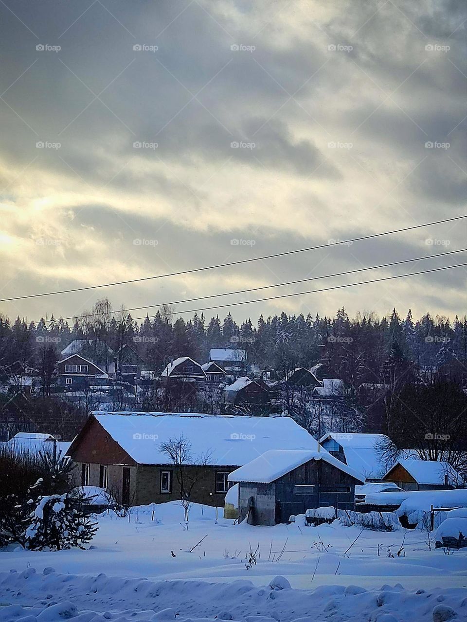 Winter view of a small village in the Moscow region (Russia).  Everything is covered with snow.  Silence and harmony