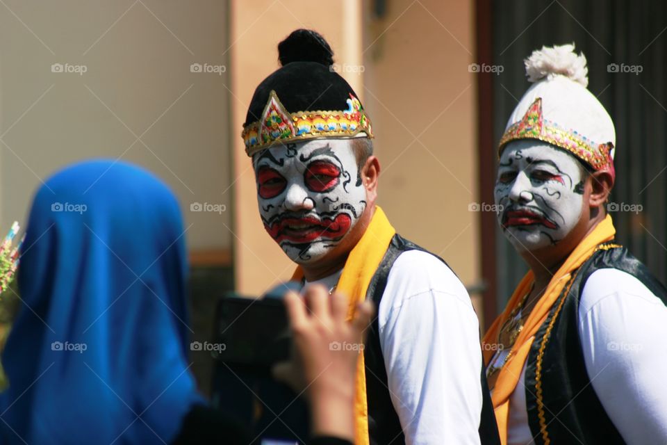 one of character punokawan on the street while festival, java