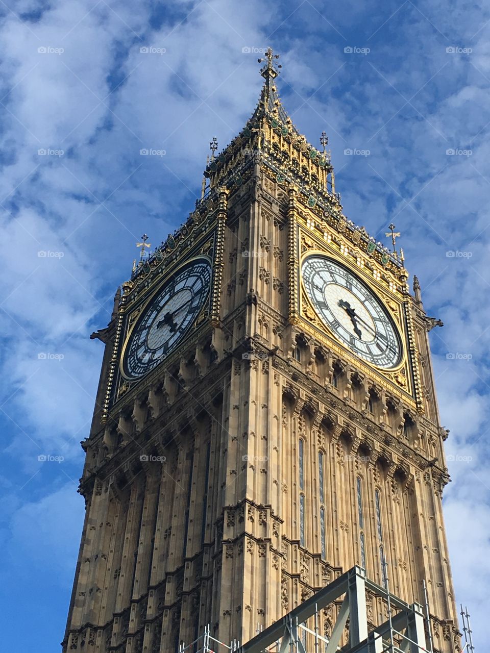 A close up of Big Ben in London against a blue sky 