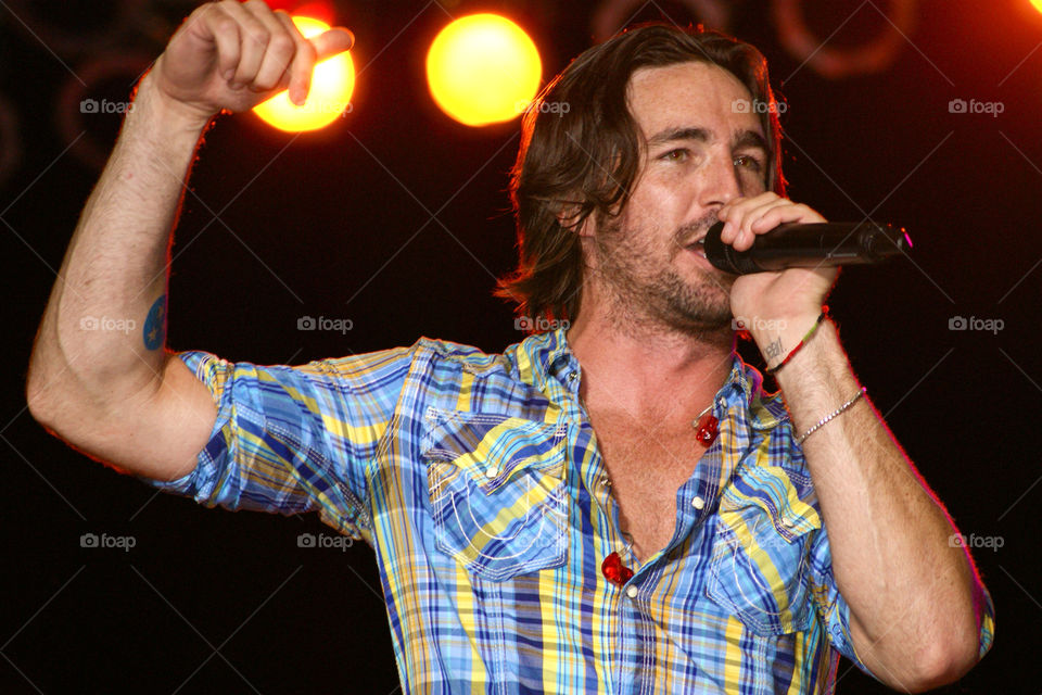 Jake Owen rocking the stage . Concert picture 
