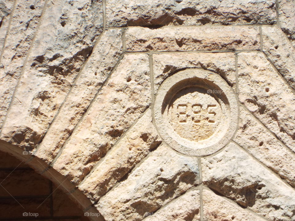 1895 on the side of a house