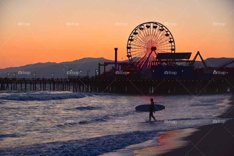 Surf's up at Santa Monica beach at Sunset 