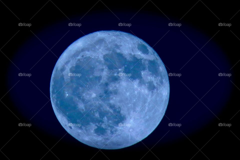 Full harvest moon in blue