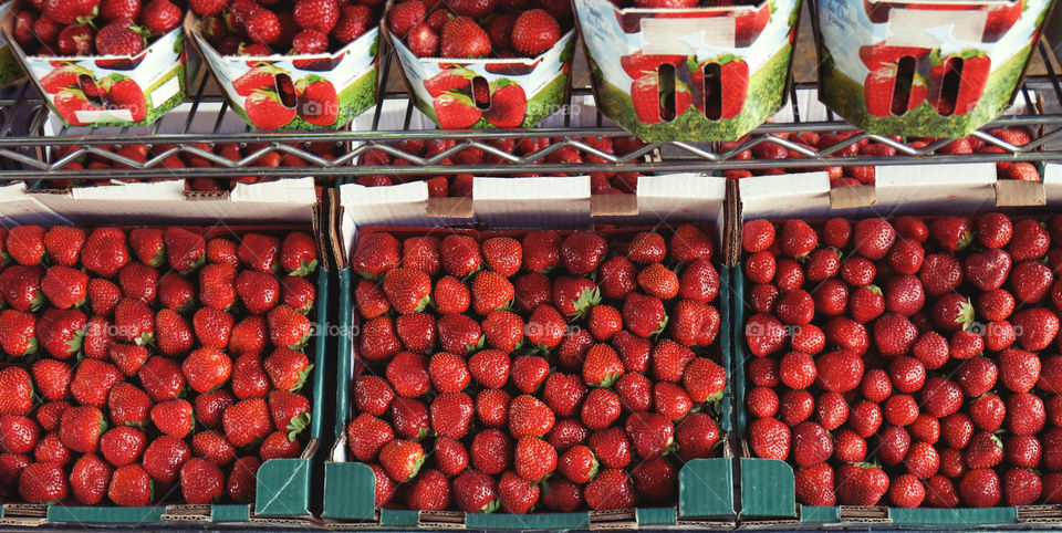 beautiful stacks of fresh tomatoes and strew berries