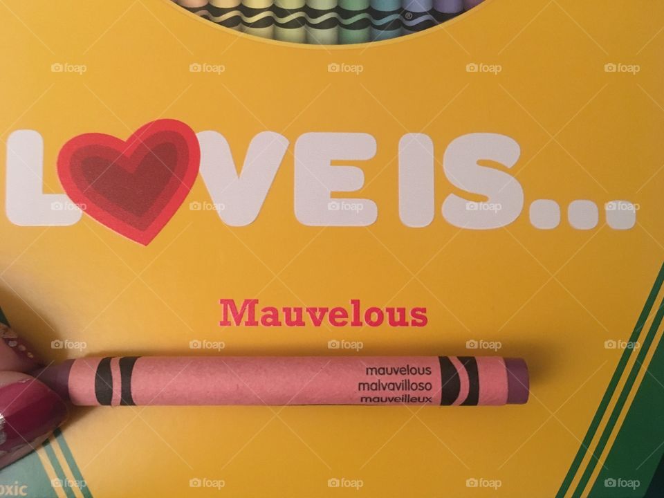 Custom crayola crayon box with a mauve crayon held in front 