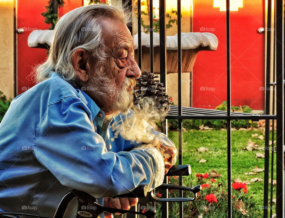 Old man smoking pipe