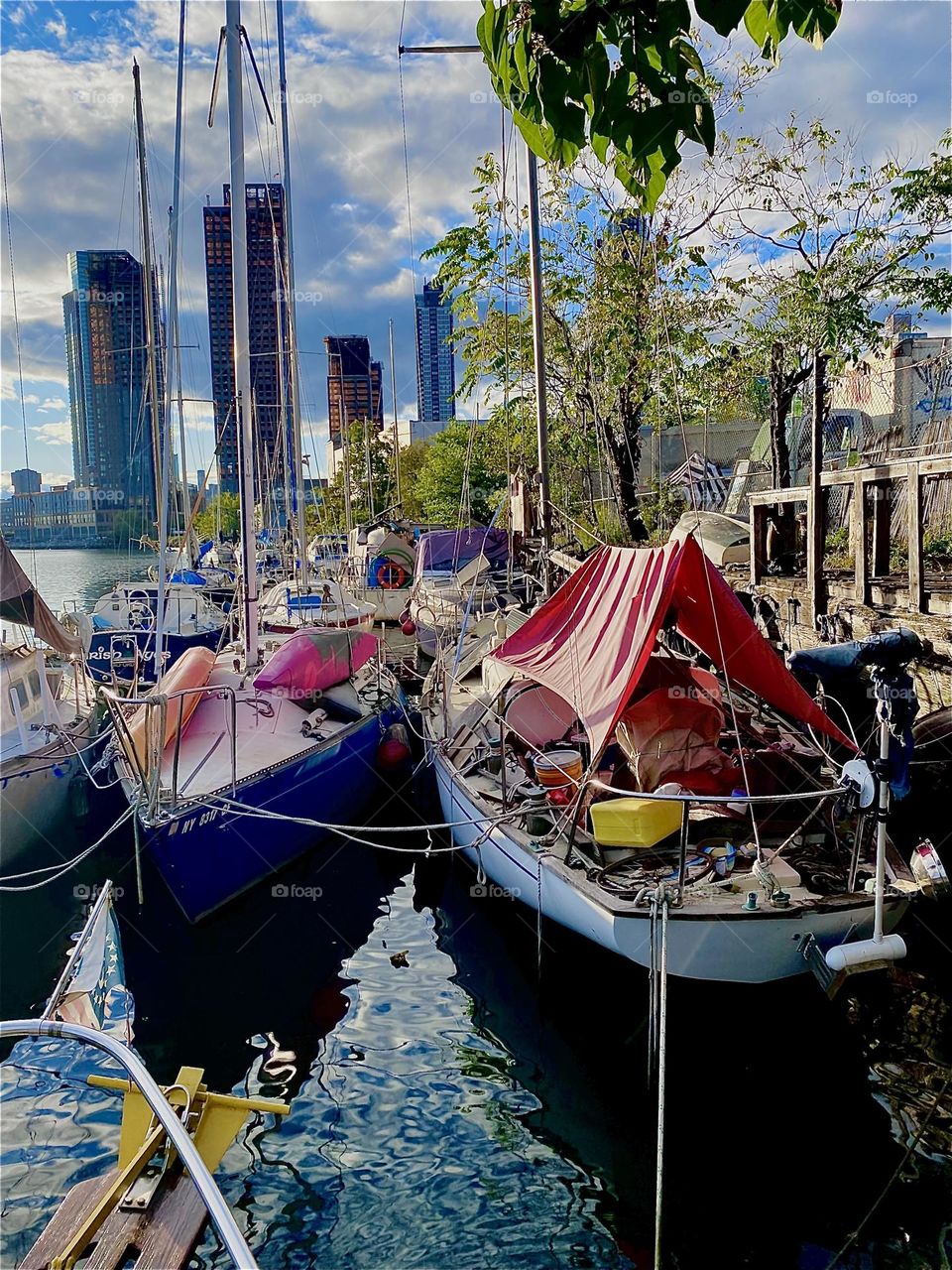 This is beautiful “Newtown Creek” by the “Pulaski Bridge” in LIC, Queens in the evening sun that is about to set. Its last rays are intensified by the reflection off the ocean. 2023. Hypnotic Productions