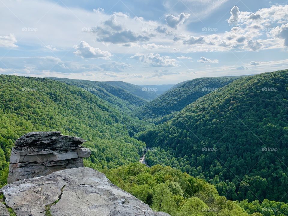 My husband and I spent our 20th anniversary in the magnificent mountains of West Virginia, reminiscing and looking forward. This image captured that feeling of that day: a solid foundation laid for our future and the vast land yet to explore! 