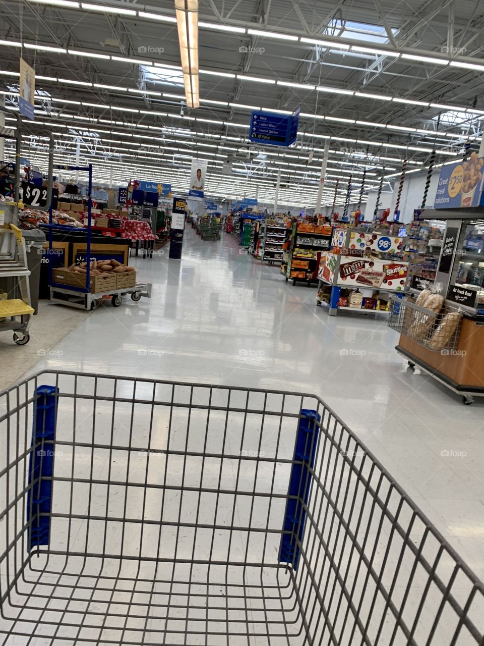 Empty store isles while shopping during the pandemic at the grocery store - Walmart store in USA, America - Black Friday Shopping during Covid, Coronavirus 2020