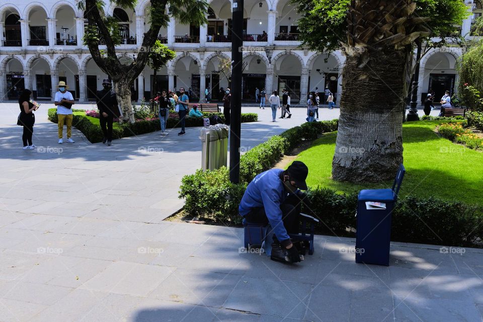 Man with a job as a bootblack