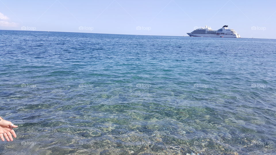 Giardini Naxos beach with cruise ship