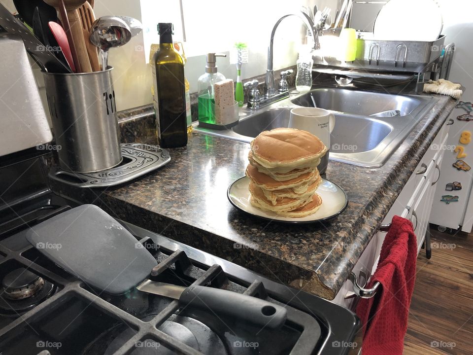 Stack of pancakes in kitchen counter