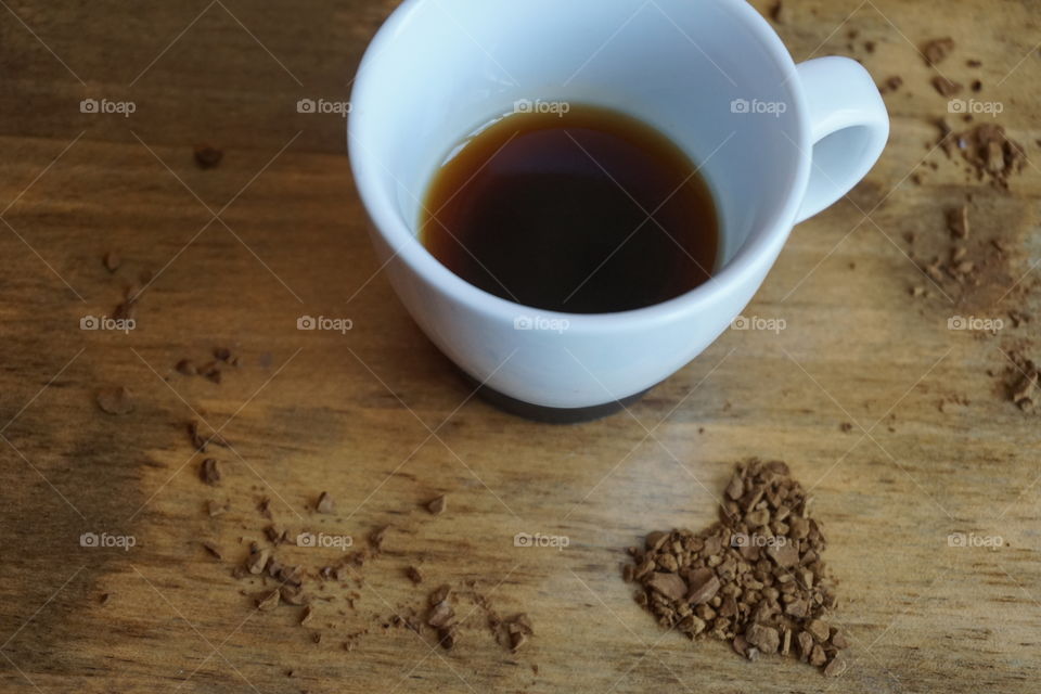 Black coffee and powder on table