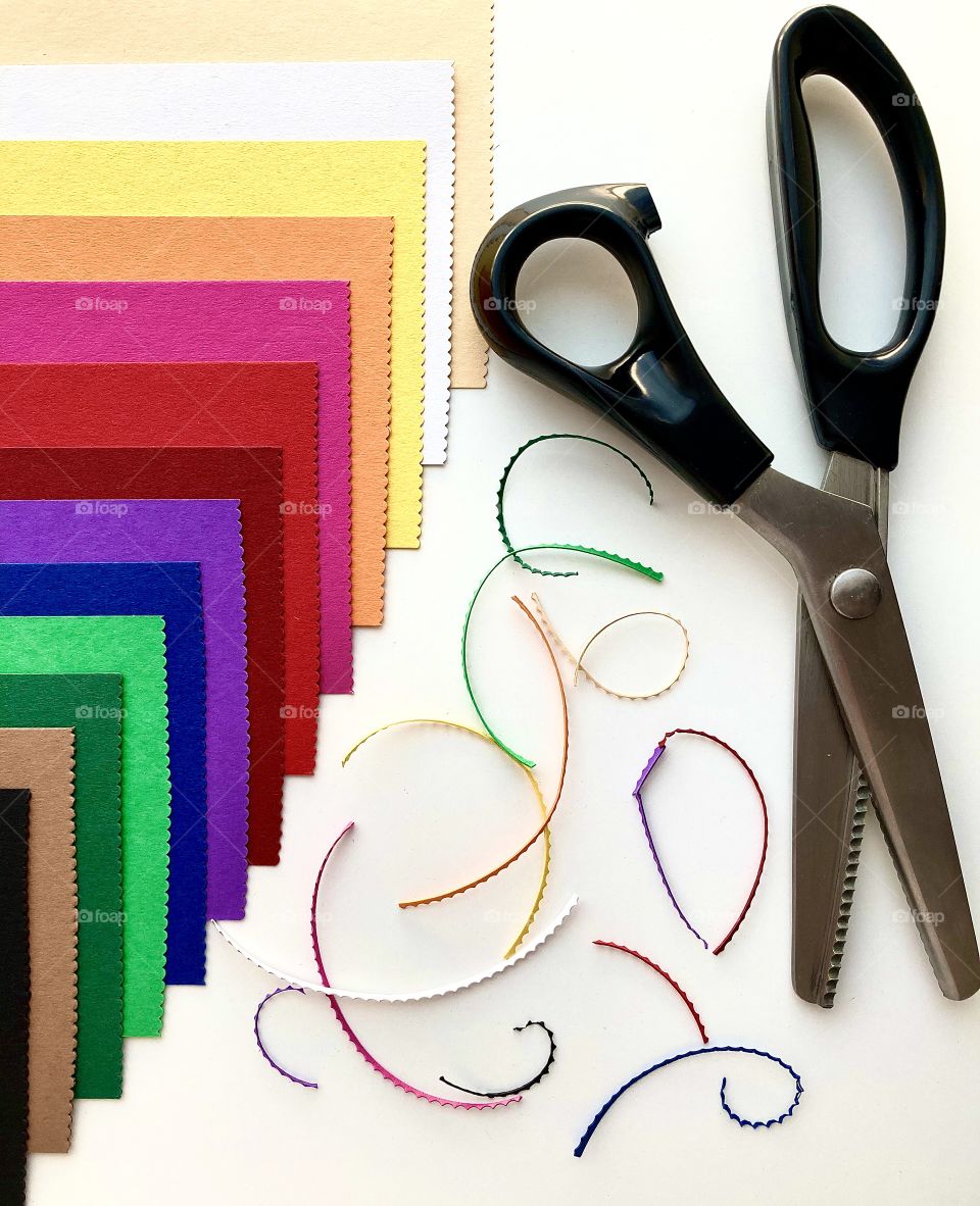 Curly scissors and curly edge of paper
