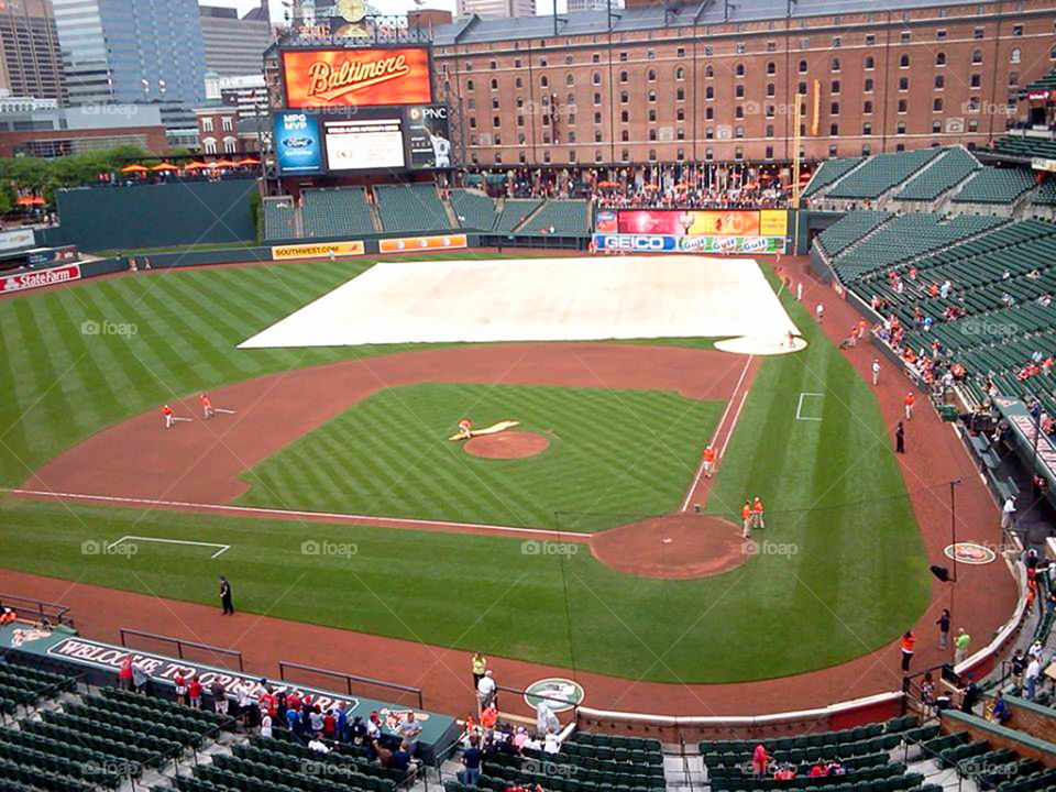 rain delay. Camden Yards prepares for rain delay