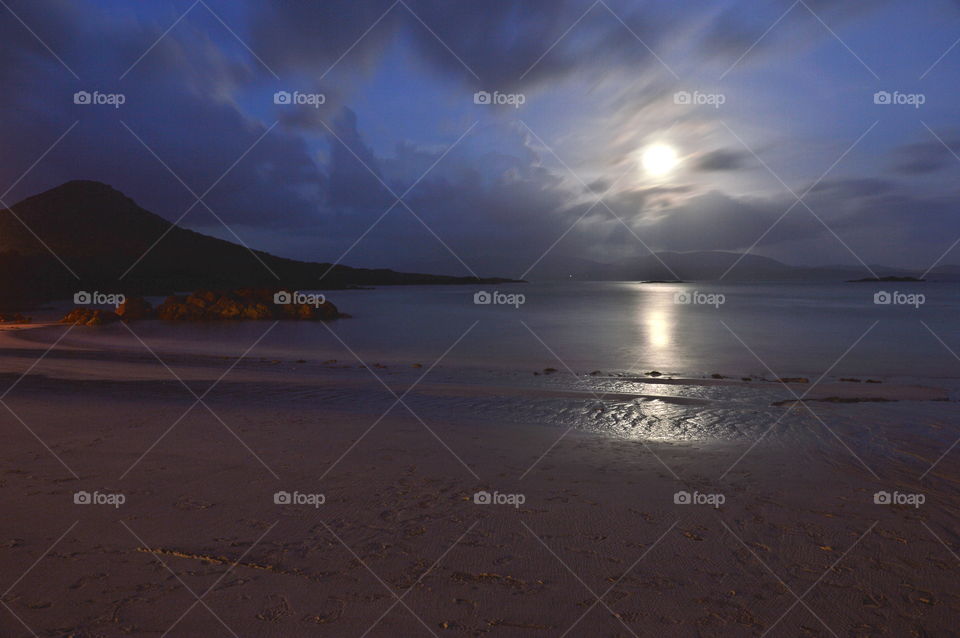 Full moon reflecting off the ocean