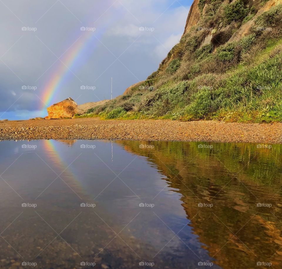 Rainbow and its reflection 