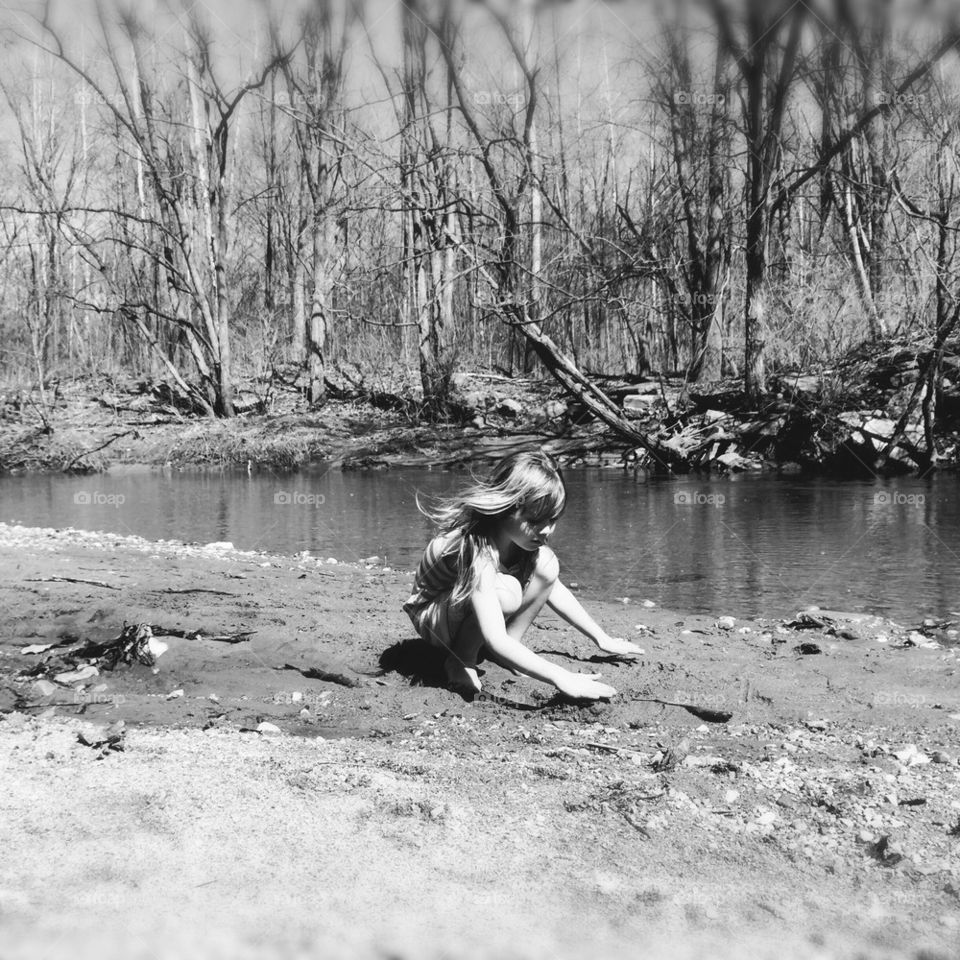 Girl by the creek