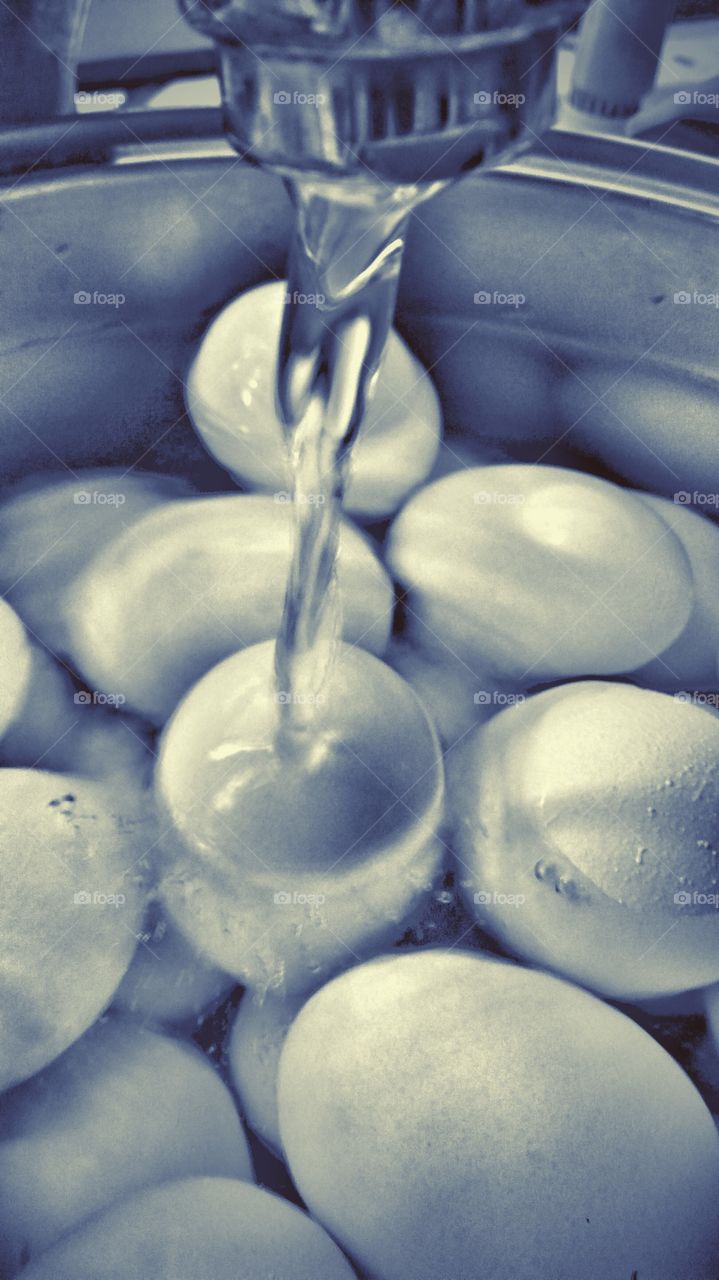 Filling a pot of water for boiling eggs