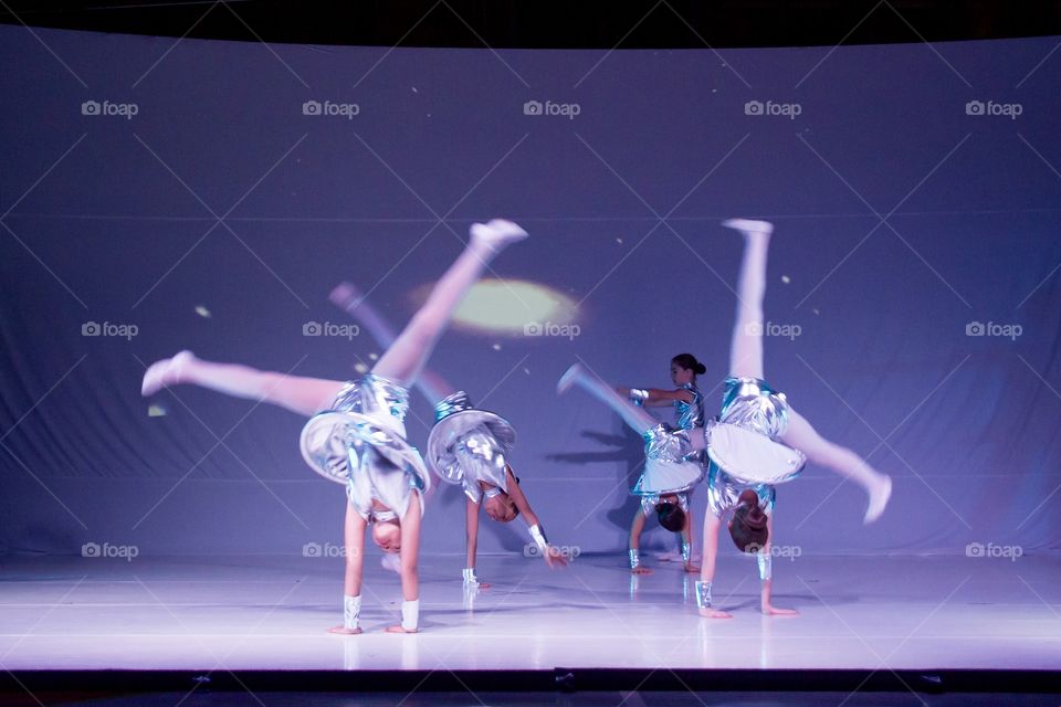 Children doing acrobatics at a dance performance