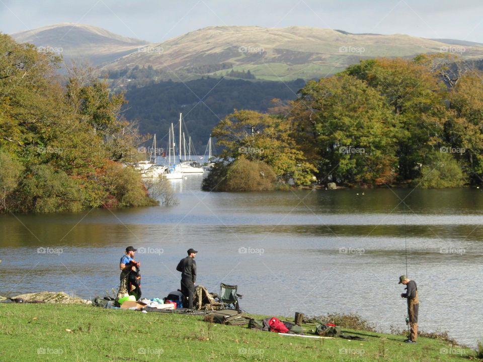 People fishing on lake windermere