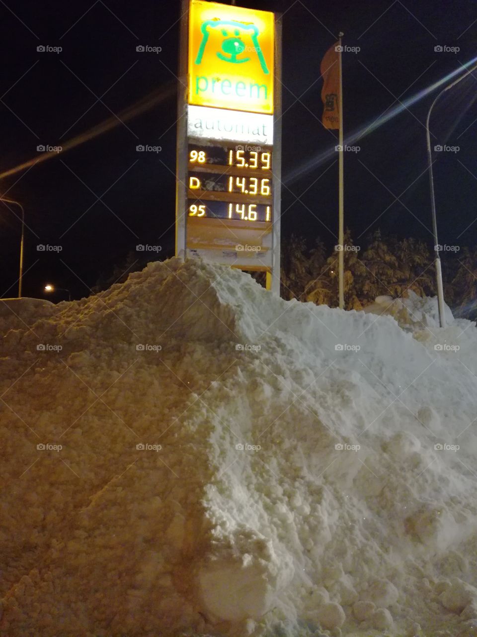 Gasstation sign covered in snow