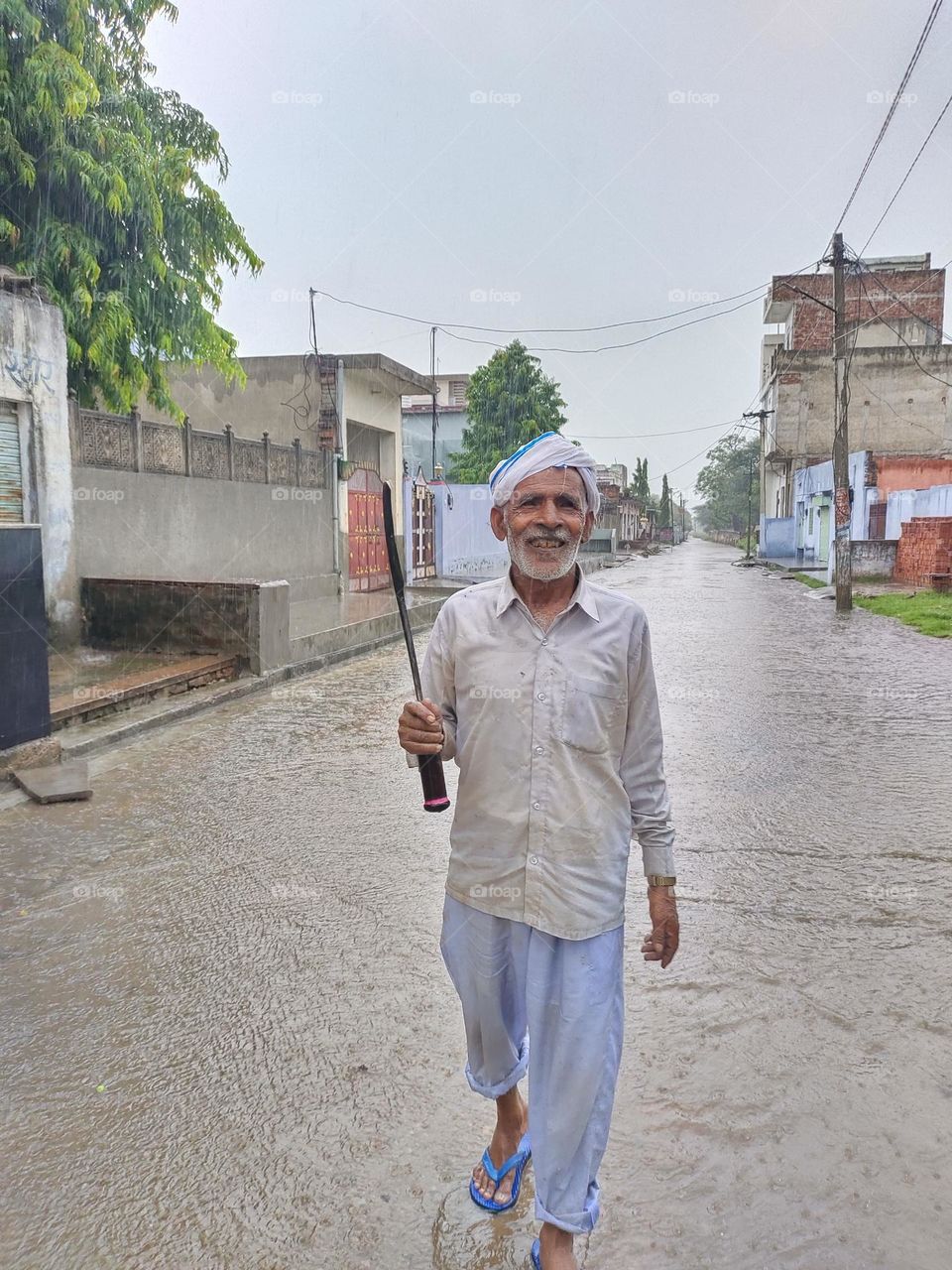 this man returns home from work in rain with a beautiful smile