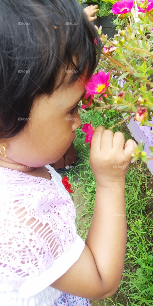 my daughter is beautiful like the flower she kissed
