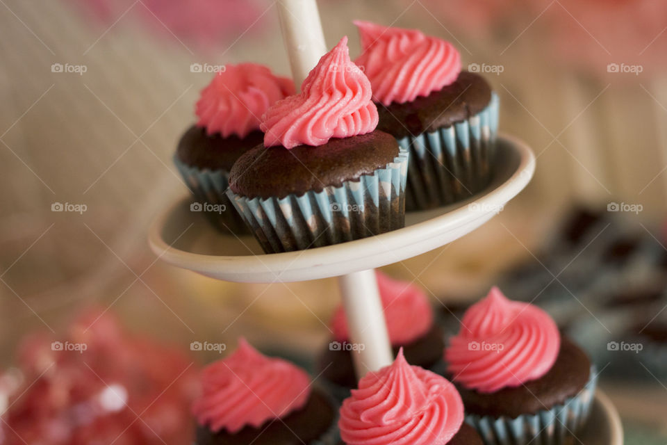 Close-up of cup cake on cake stand