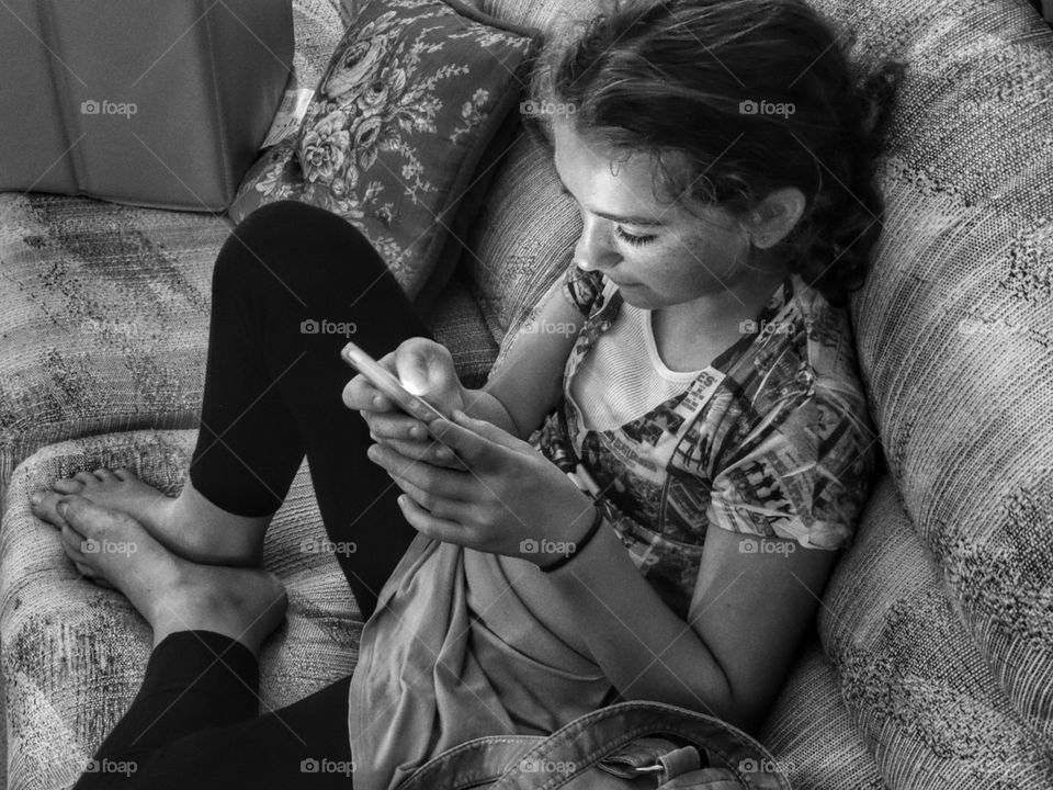 Young Girl Using A Mobile Device