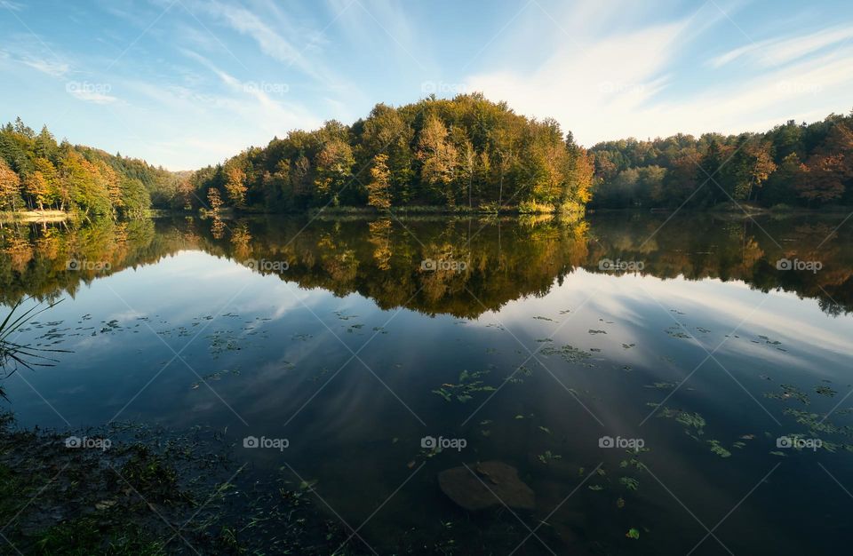 Beautiful nature scenery with forest reflected in water at Trakoscan lake in Croatia, county hrvatsko zagorje