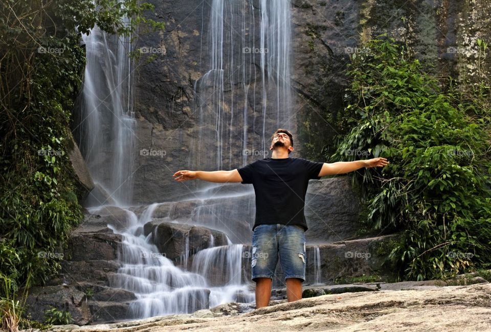 Man at waterfall