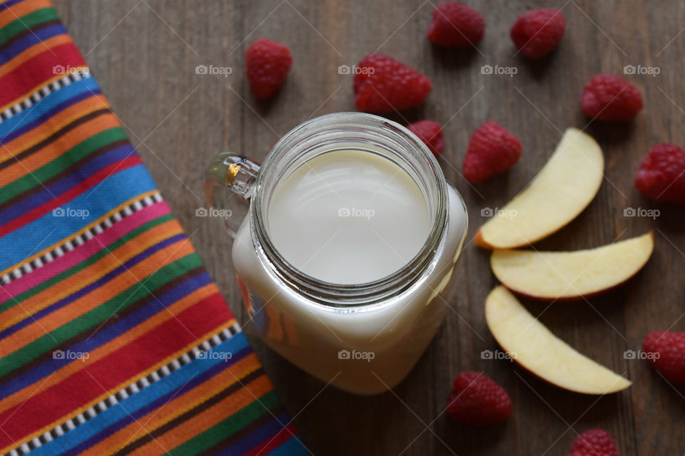 Cold glass of milk with fruit