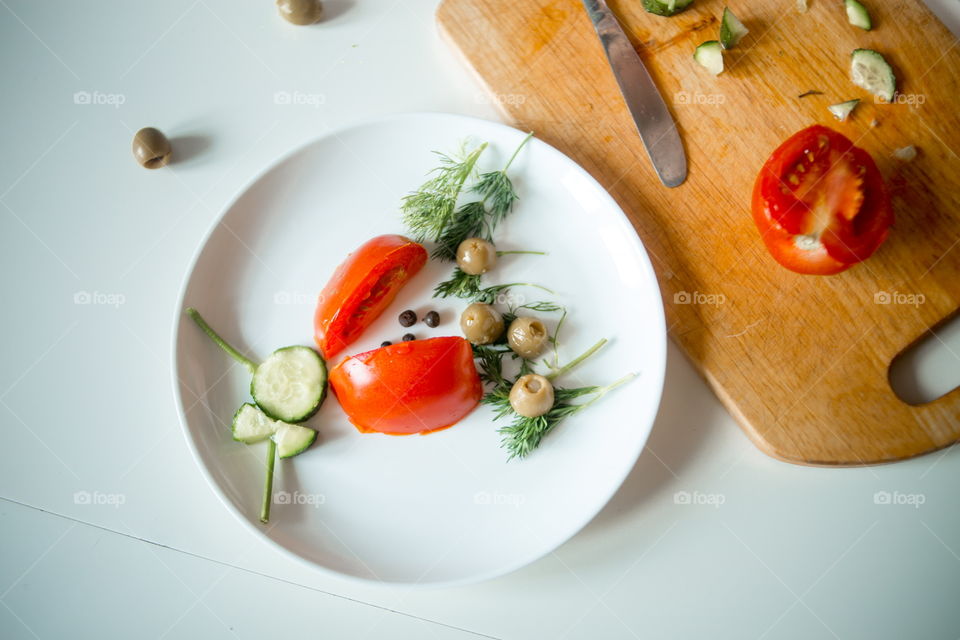 Child vegetables salad. Process 