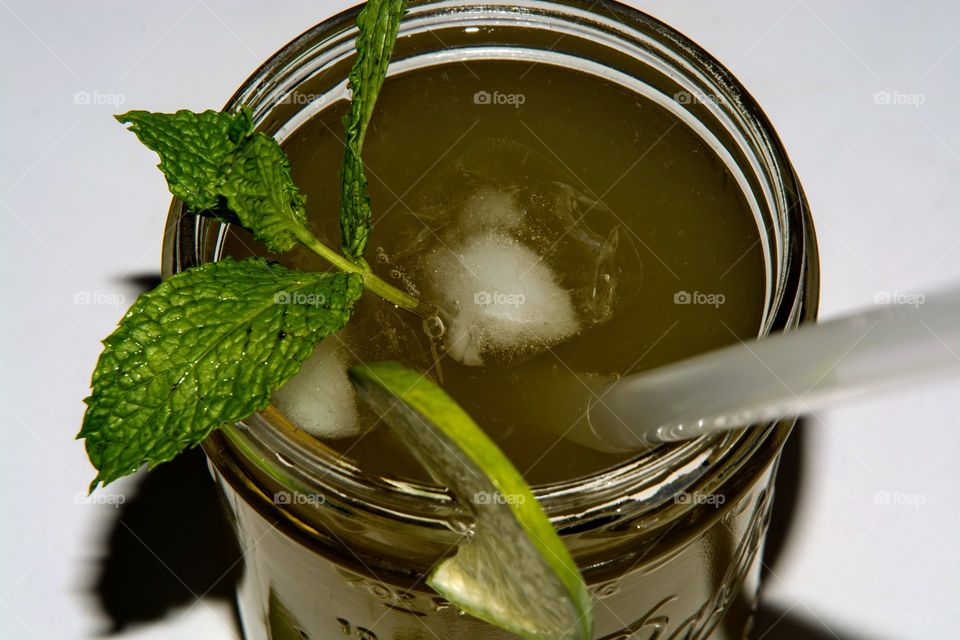 matcha drink with mint and lime in a mason jar