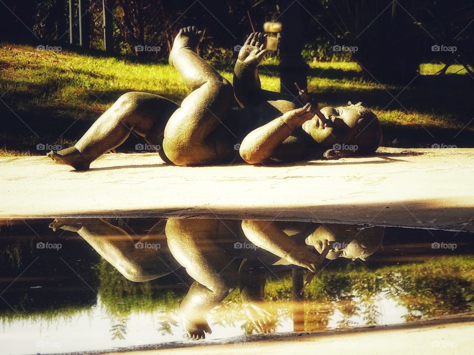 Playing the flute by the lake
