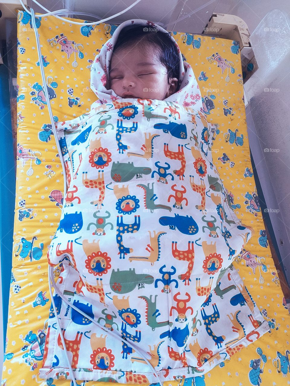 Little Baby Sleeping on NICU Hospital bed